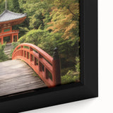 Close-up of a framed landscape canvas artwork depicting a serene bridge scene, featuring vibrant colors and intricate details, perfect for enhancing home decor.