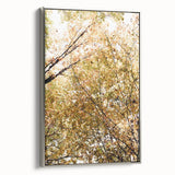 Framed canvas depicting a vintage-style landscape painting with colorful autumn trees and a black background.