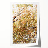 Rolled canvas print of fall-themed floral art in warm orange and yellow hues, suitable for dining room or bathroom decor.