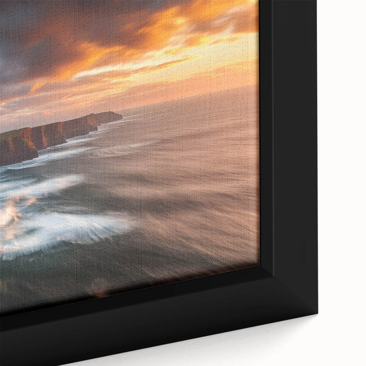 Close-up of a framed canvas artwork depicting dramatic cliffs and landscapes, showcasing vibrant colors and intricate details, perfect for home decor.