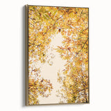 Framed canvas wall art featuring a vintage-style landscape with fall foliage in gold and black tones.