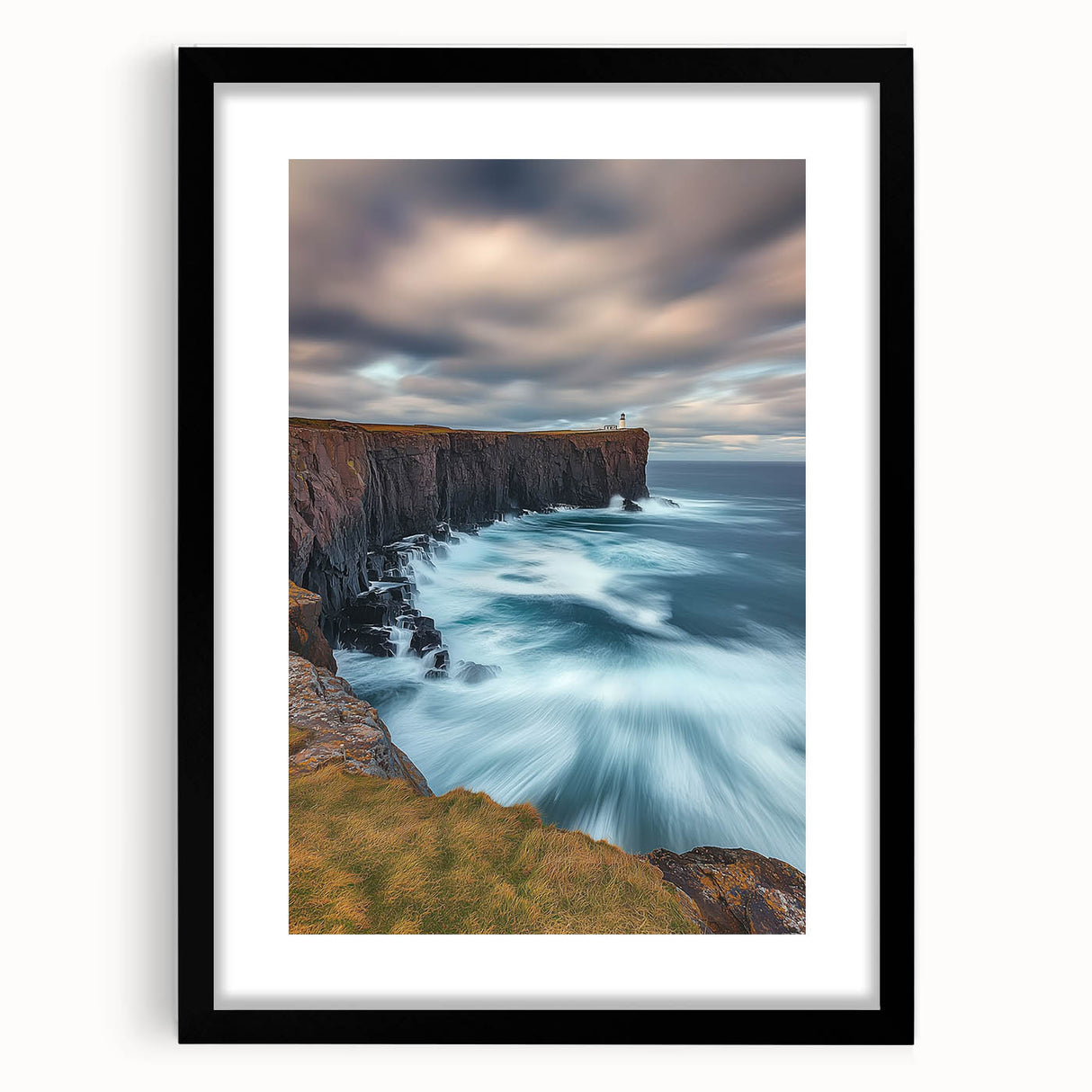 Black-framed landscape artwork featuring majestic cliffs, set against a serene backdrop. The piece is elegantly matted, enhancing its visual appeal and ideal for home decor.