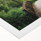 Rolled canvas showcasing a stunning landscape bridge design, featuring vibrant colors and intricate details, packaged securely in a protective cardboard tube. Ideal for home decor enthusiasts seeking unique wall art.