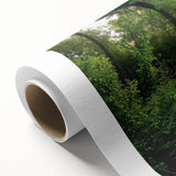 Rolled canvas artwork showcasing a stunning landscape bridge design, featuring vibrant colors and intricate details, packaged in a protective cardboard tube for display.