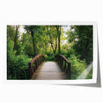 Landscape bridge rolled print showcasing a serene river scene with lush greenery and a vibrant blue sky, rolled neatly for easy transport and display.