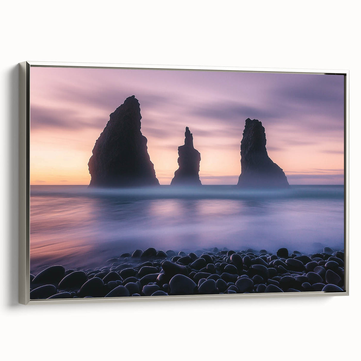 Framed canvas artwork depicting dramatic cliffs and landscapes, showcasing a silver frame. Ideal for enhancing home decor with a modern aesthetic.