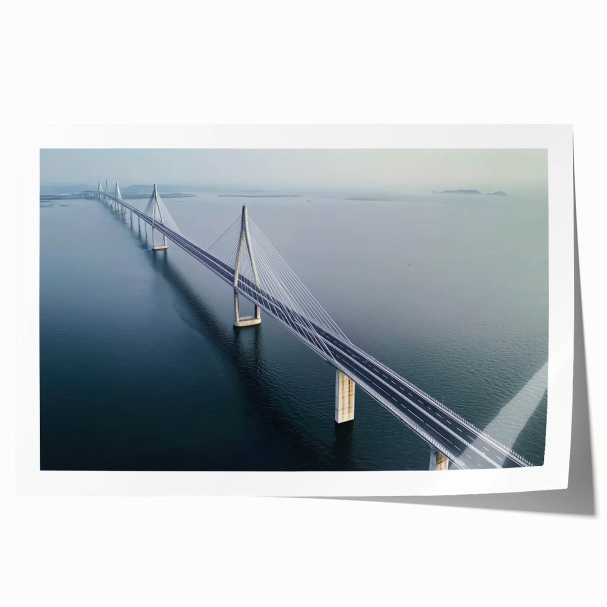 Rolled print showcasing a stunning landscape bridge design, featuring vibrant colors and intricate details, packaged securely in a protective cardboard tube for safe transport.