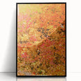 Large abstract wall art depicting fall season in warm orange and brown tones on a framed acrylic print.