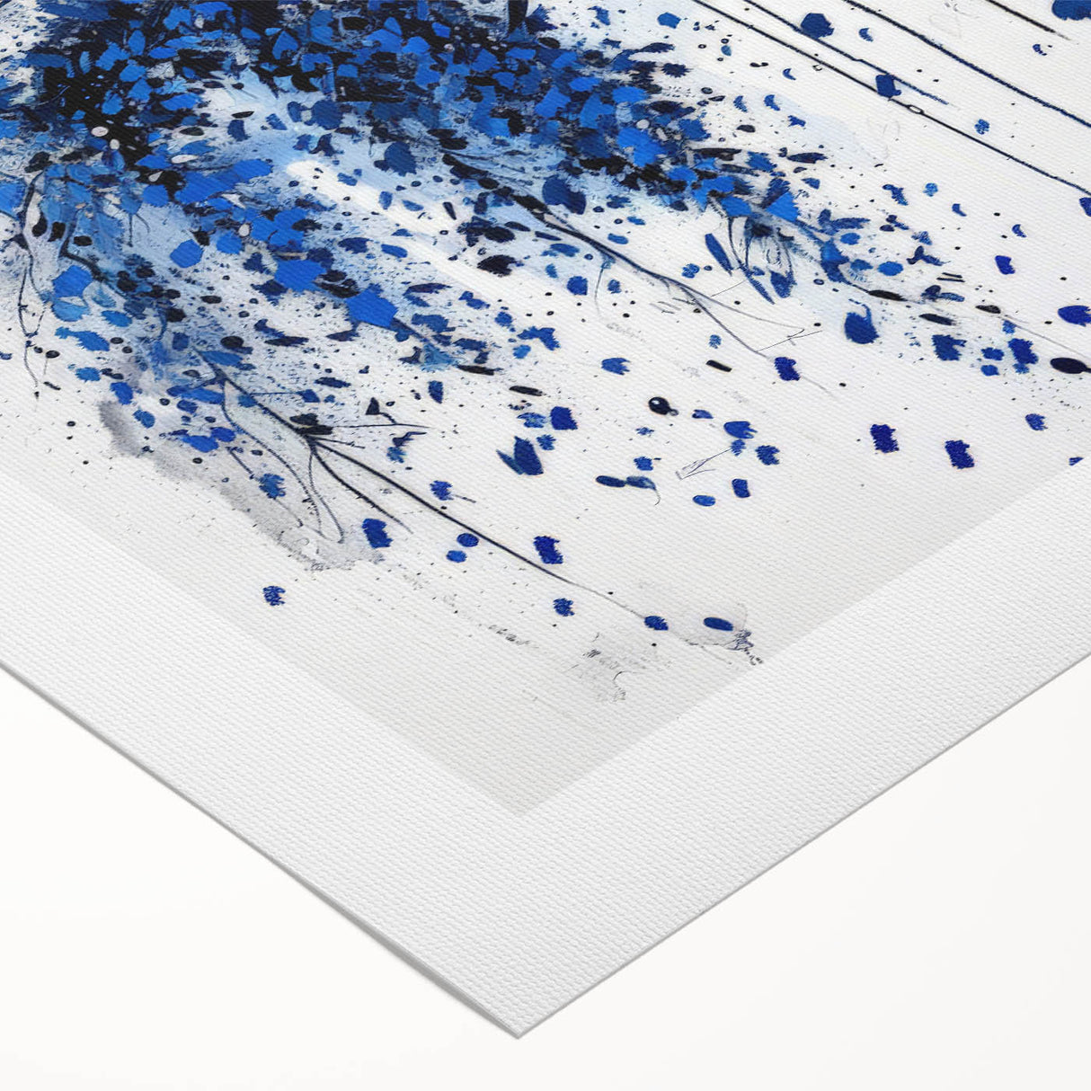 Abstract rolled canvas artwork displaying vibrant splatter designs in shades of blue, red, and yellow. Ideal for modern home decor, it adds a dynamic touch to any space.