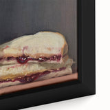 Close-up of a framed canvas featuring a black wall art design of colorful pastries.