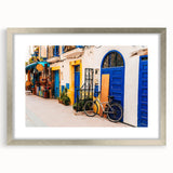 Abstract art print of Moroccan landscape in muted earth tones on a framed silver mat, suitable for dining room decor.