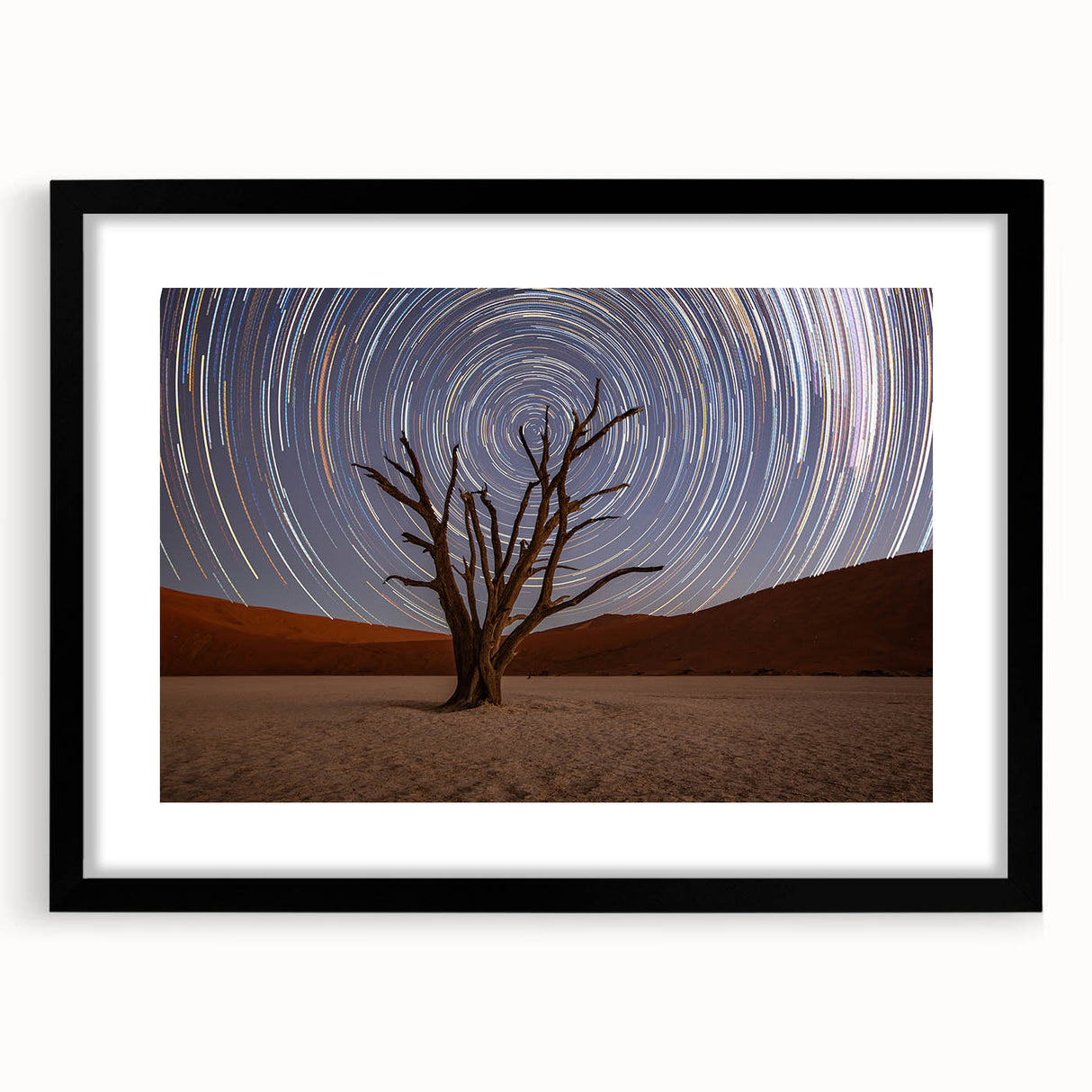Extra large abstract art print depicting a colorful, textured African scenery on a black framed canvas.