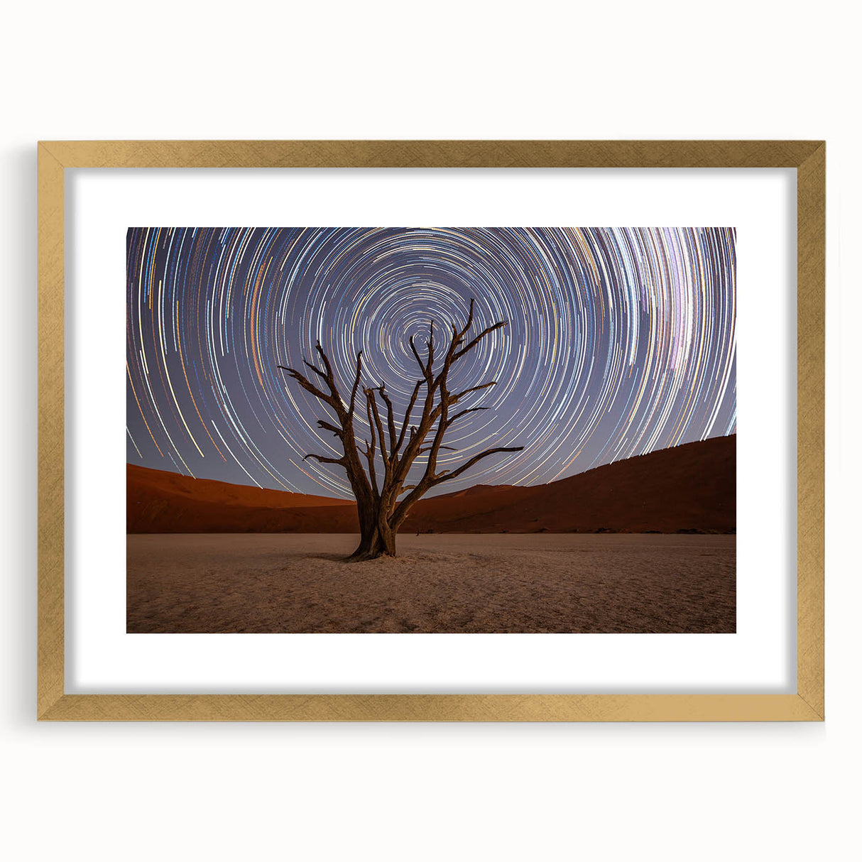 Textured art depicting abstract African scenery in earthy tones on a gold-framed canvas, suitable for bedroom decor.