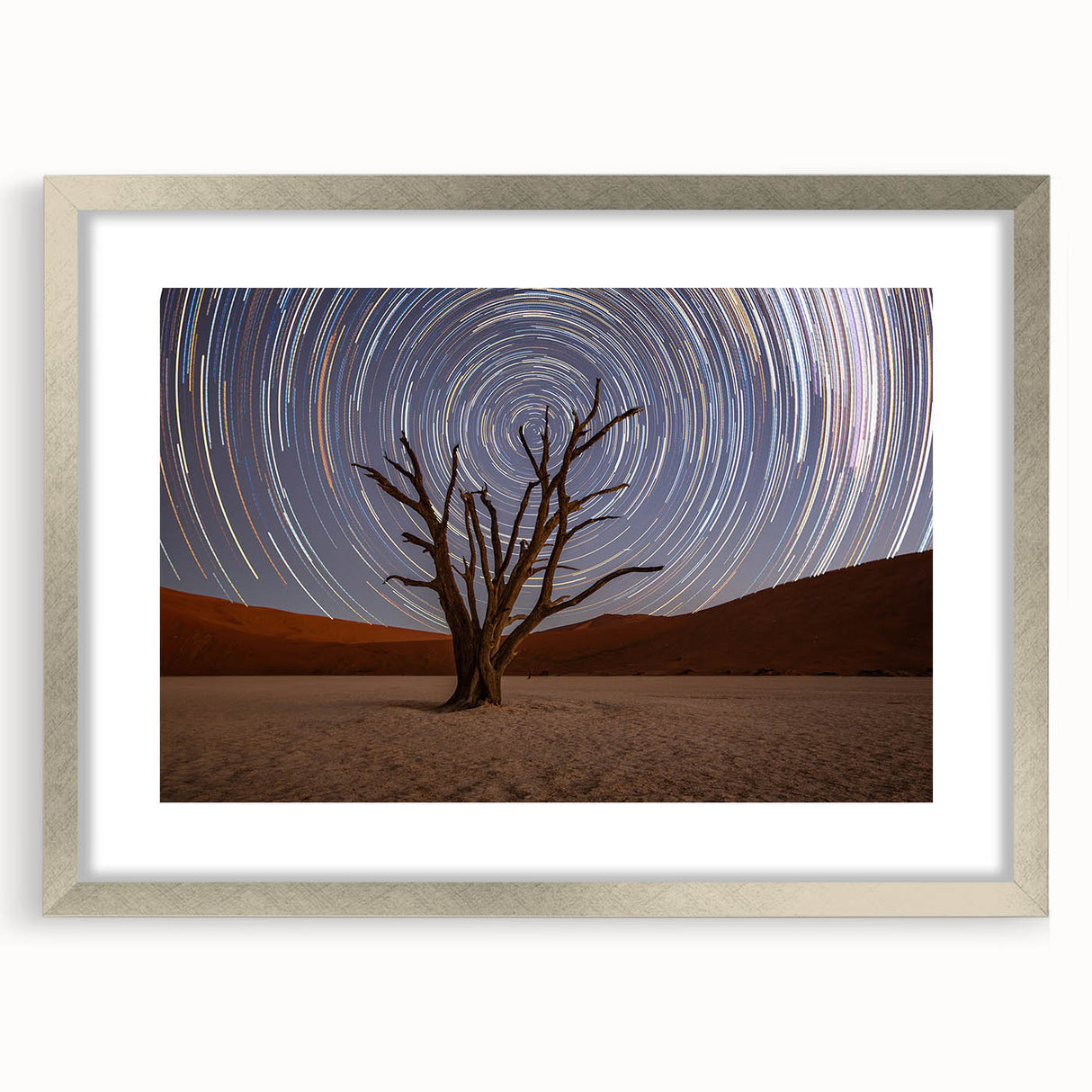 Abstract art print depicting a serene Namibian landscape in muted earth tones, framed in silver.