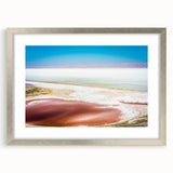 Textured abstract art print depicting a Tunisian landscape in earthy tones on a framed silver mat, ideal for bedroom decor.