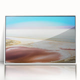 Art deco poster of a Tunisian landscape on white framed acrylic, featuring muted earth tones.