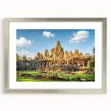 Textured art depicting an abstract Cambodian landscape in earthy tones on a framed silver mat, suitable for bedroom decor.