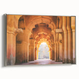 Framed canvas featuring a vintage-style landscape painting of an Indian scenery in colorful and black tones.