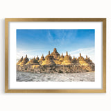 Extra large abstract art print featuring textured scenery of Indonesia, in gold frame, suited for living room decor.