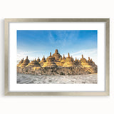 Textured abstract art print depicting a serene Indonesian landscape in muted earth tones, framed in silver.