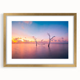 Extra large abstract art print depicting a serene Maldivian landscape in muted blue and green tones, framed in gold.