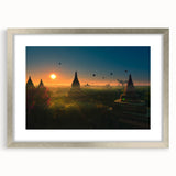 Textured art of a Myanmar landscape in muted earth tones on a framed silver mat, suitable for bedroom decor.