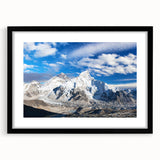 Abstract art print depicting a colorful, textured landscape of Nepal, framed in black, ideal for large living room walls.