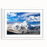 Abstract art print of a Nepalese landscape in muted earth tones, framed in white, ideal for dining room decor.