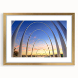Textured abstract art print depicting the Perth skyline in muted gold and blue tones on a framed canvas.