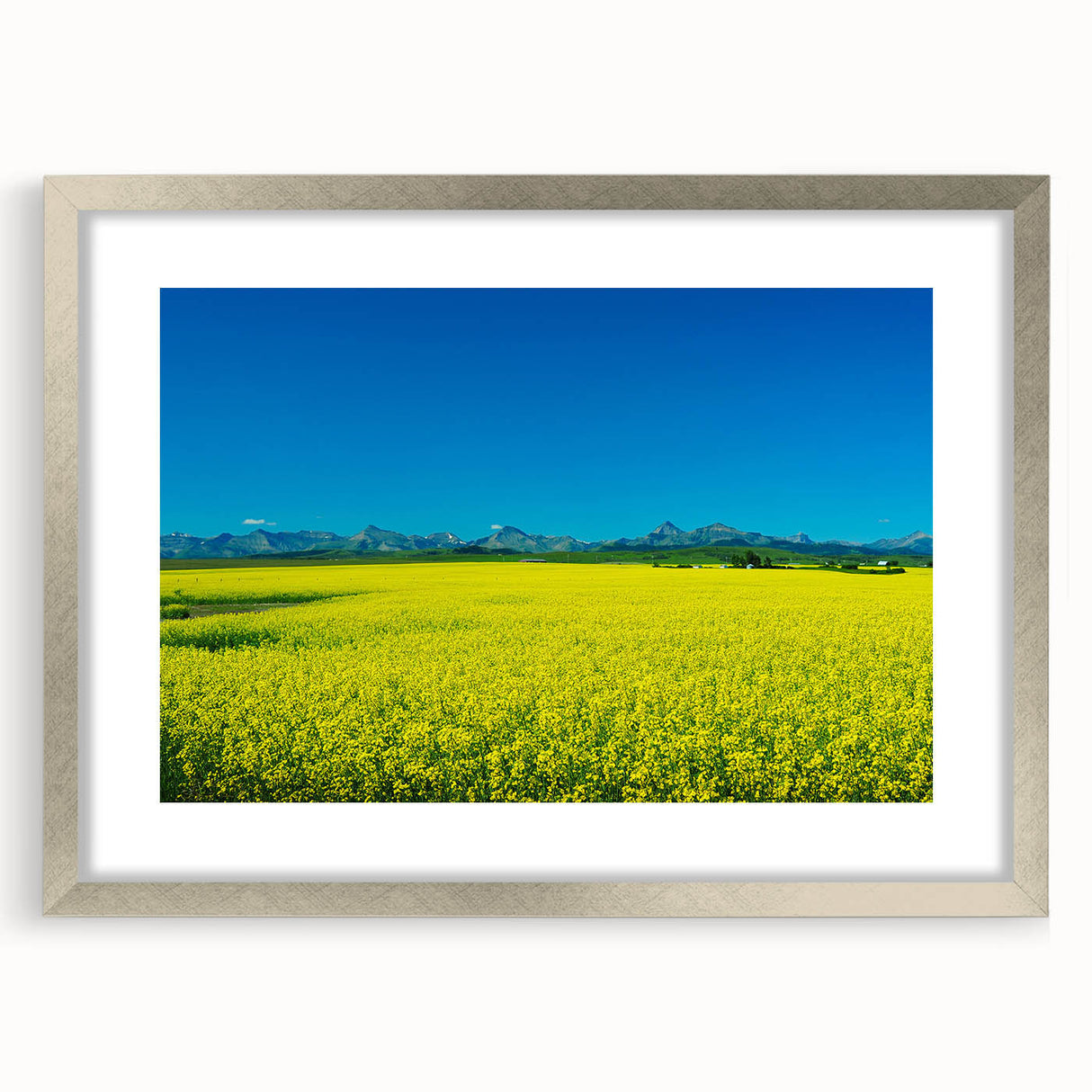 Textured abstract art print depicting Alberta scenery in muted earth tones, framed in silver, perfect for bedroom decor.