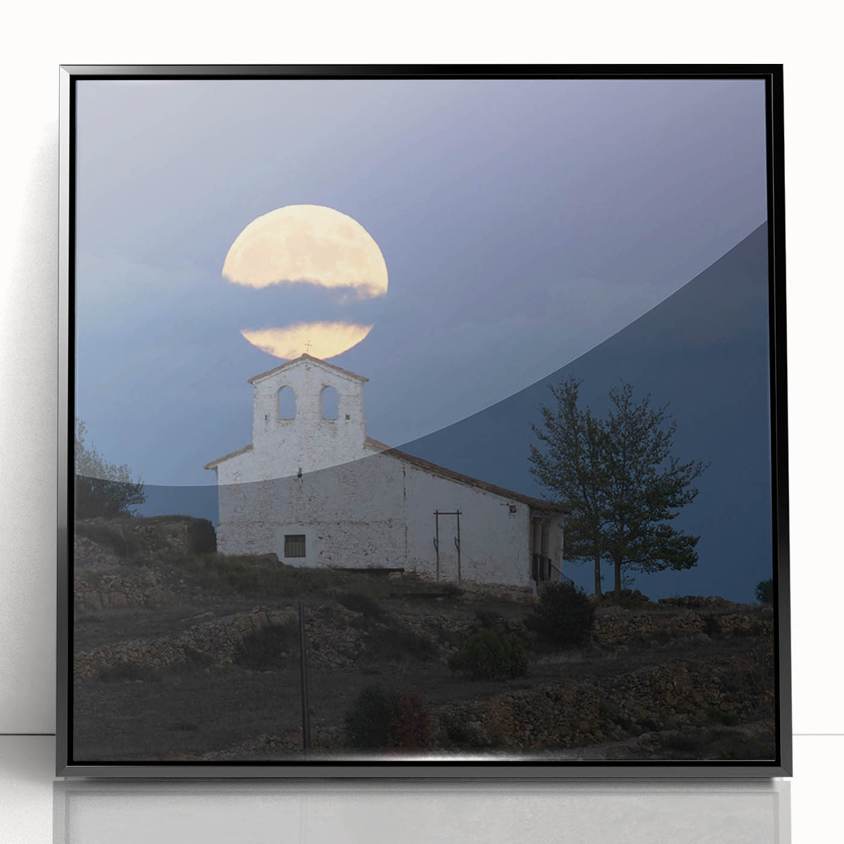 Large abstract wall art depicting Caribbean scenery in muted blue and green tones, framed in black acrylic.