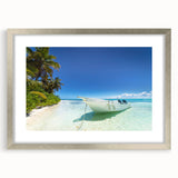 Extra large abstract art print of Caribbean scenery in a silver frame, featuring textured blues and greens.