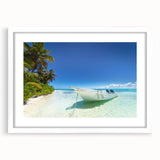 Textured abstract art print of a Caribbean scenery in pastel blue and green hues on a framed white mat.