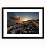 Extra large colorful abstract art print of a Caribbean scenery, displayed in a black frame with mat.