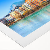 Art deco poster of a scenic European village in muted earth tones on rolled canvas, suitable for dining room decor.