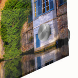 Large abstract wall art of a European scenery in muted earth tones on acrylic glass, ideal for dining room ambiance.