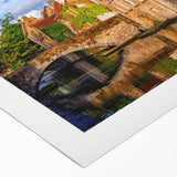 Art deco poster of a European cityscape in muted brown and blue tones on rolled canvas, ideal for dining room decor.