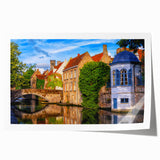 Scenic European landscape with floral motifs in soft green and blue hues on a rolled canvas, suitable for dining room decor.