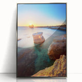 Large art print of a European Cyprus landscape in muted green and blue tones, framed in silver acrylic.