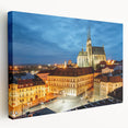 A stretched canvas print of the Charles Bridge in Prague, featuring muted gray and blue tones, ideal for kitchen wall art.