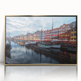 Art deco poster depicting a serene European landscape in muted pastel tones, framed in gold acrylic.