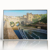 Mid-century modernist art depicting the Bath, England skyline in muted blue and gray tones on a white acrylic frame.