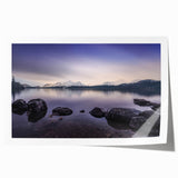 Rolled print of Cumbria landscape with lush greenery and floral elements, in soft earth tones.