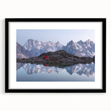 Abstract art print of the French Alps in vibrant, colorful hues on a large framed canvas, ideal for living room decor.