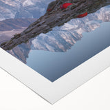 Art deco poster of the French Alps in muted blue and white tones on rolled canvas, suitable for dining room decor.