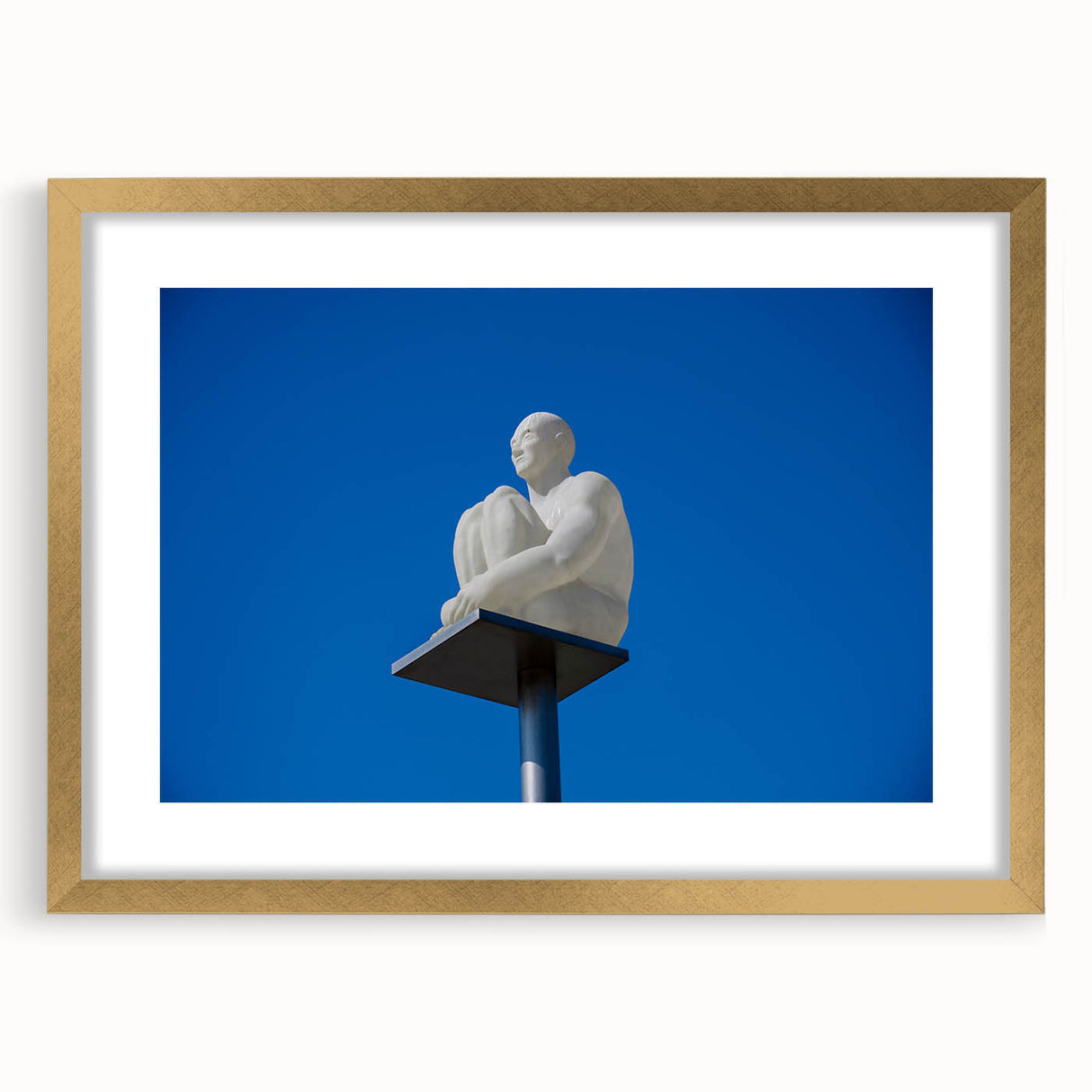Abstract art print of Nice, France in muted blue and gold tones on a framed canvas, ideal for dining room decor.