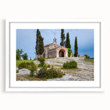 Textured art print of an abstract European landscape in muted earth tones, framed in white, ideal for bedroom decor.