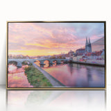 Art deco poster of Bavarian scenery in muted gold and green tones, acrylic print framed in gold.