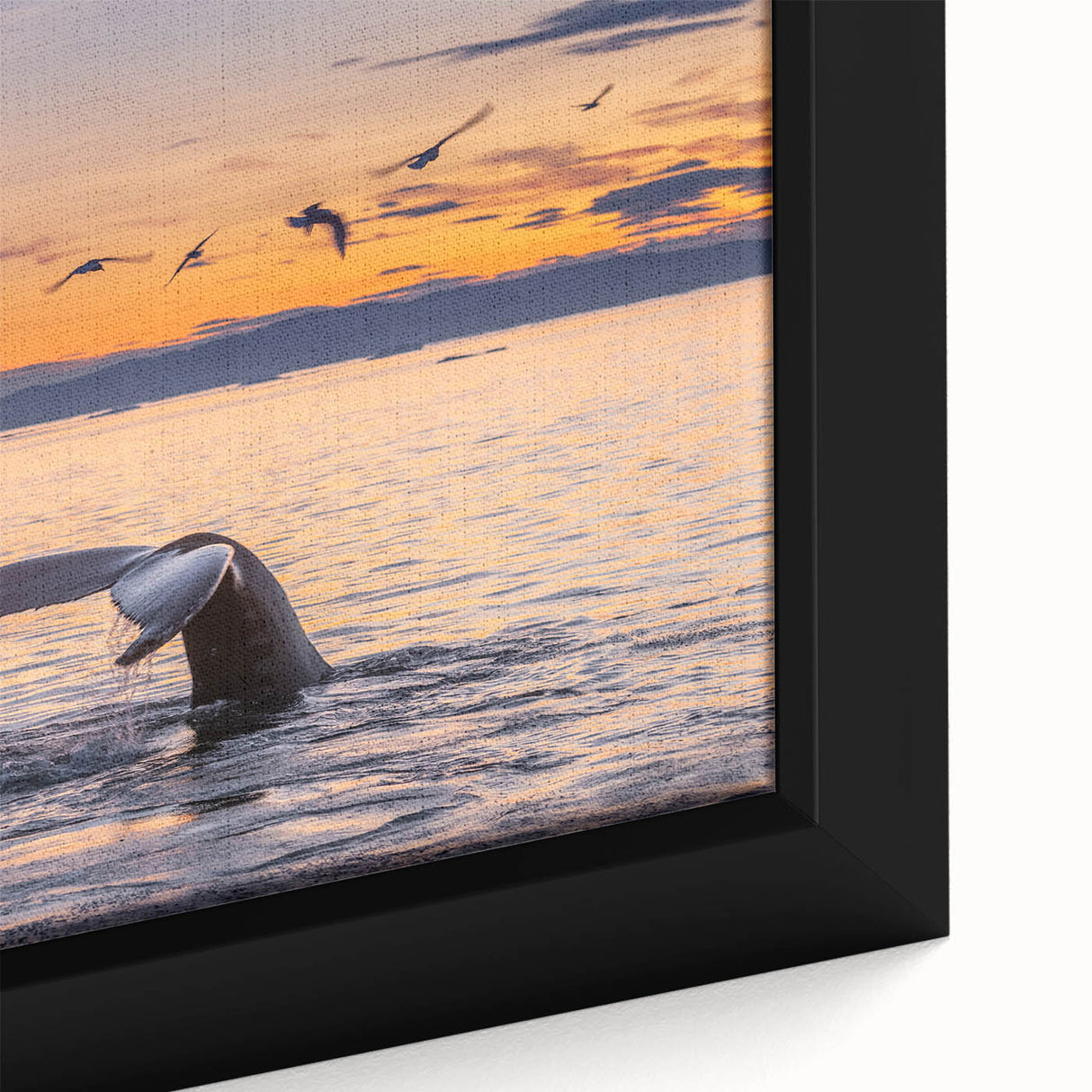 Close-up of textured black wall art depicting a European Greenland scenery on a framed canvas.