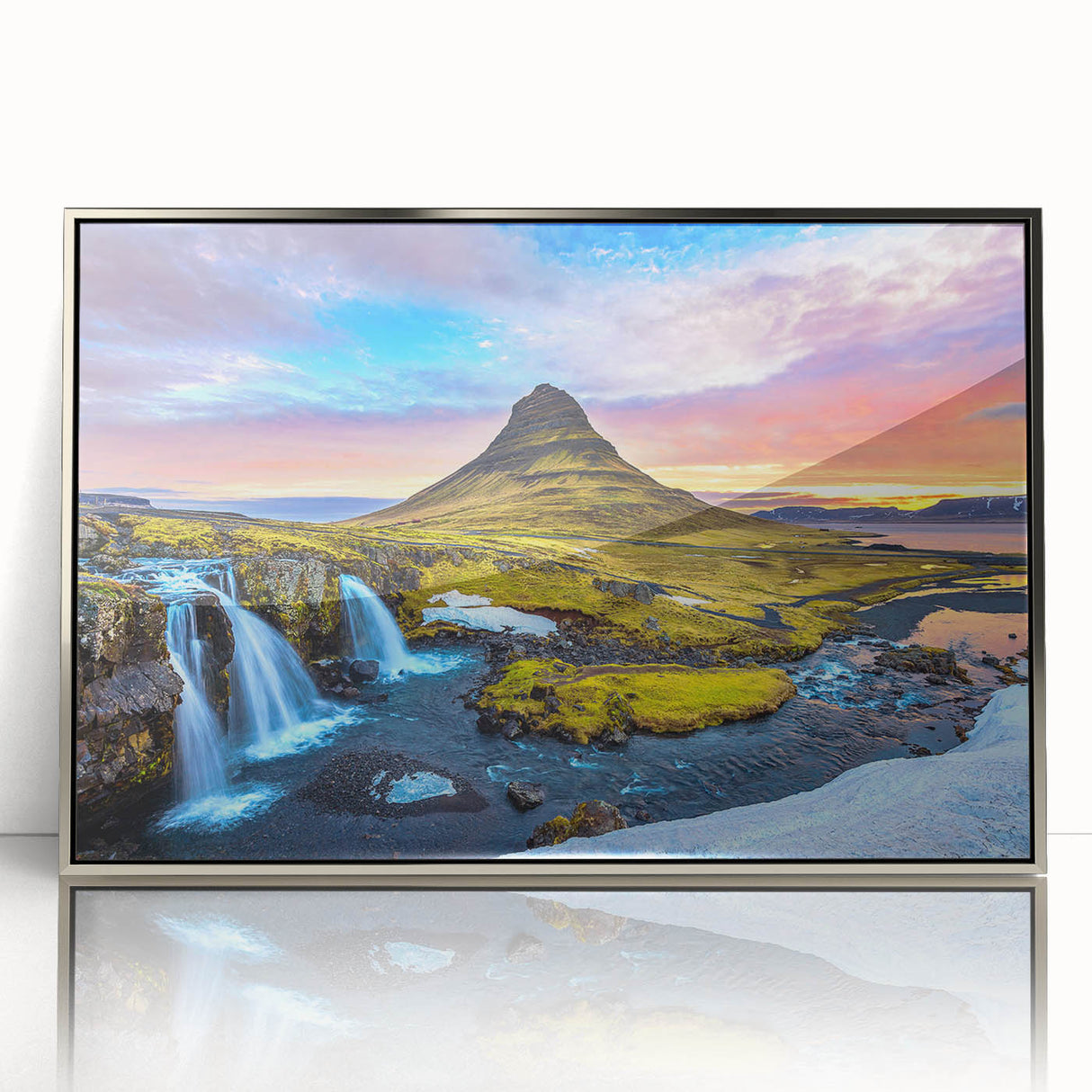 Large art print of an Icelandic landscape on a silver-framed acrylic, featuring muted earth tones.
